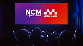 NCM and Vistar Logos on the big screen in front of moviegoers.